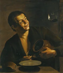 Un jeune homme mangeant à la lumière d
